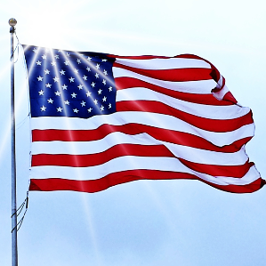 A flag that is flying in the wind.